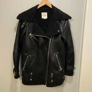 AVEC Les Filles woman’s faux leather jacket with lots of buckles